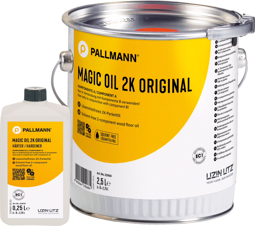 PALLMANN_dummy_Magic-Oil-2K-Original_2,75l_msl_2021-12 Close-up of a yellow-labeled metal can of PALLMANN Magic Oil 2K Original wood floor oil (2.5 L) with a small white hardener bottle (0.25 L) beside it; the label shows the brand logo, product name, usage instructions and a solvent-free icon; metal handle and sealed lid are visible; studio product photo on a white background.